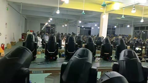 Moving head stage lights in batch production at YL Audio factory